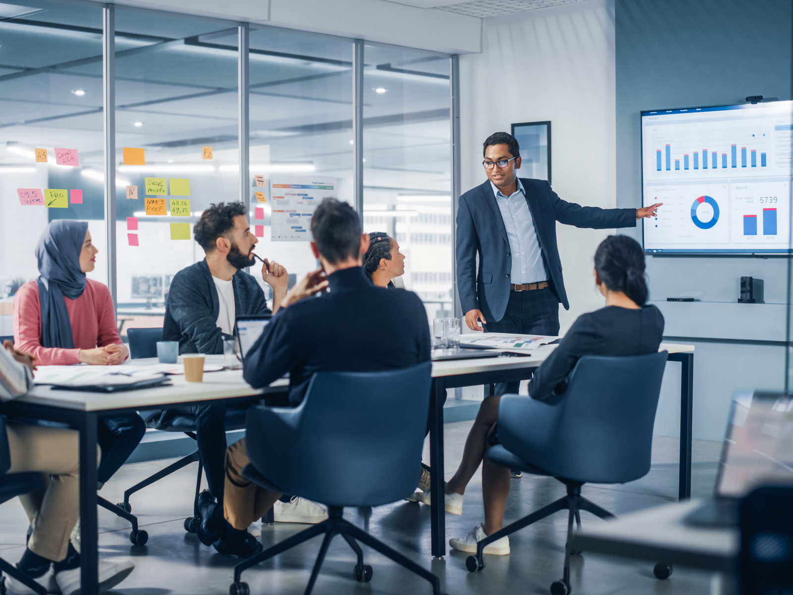 a man presenting in an office meeting room