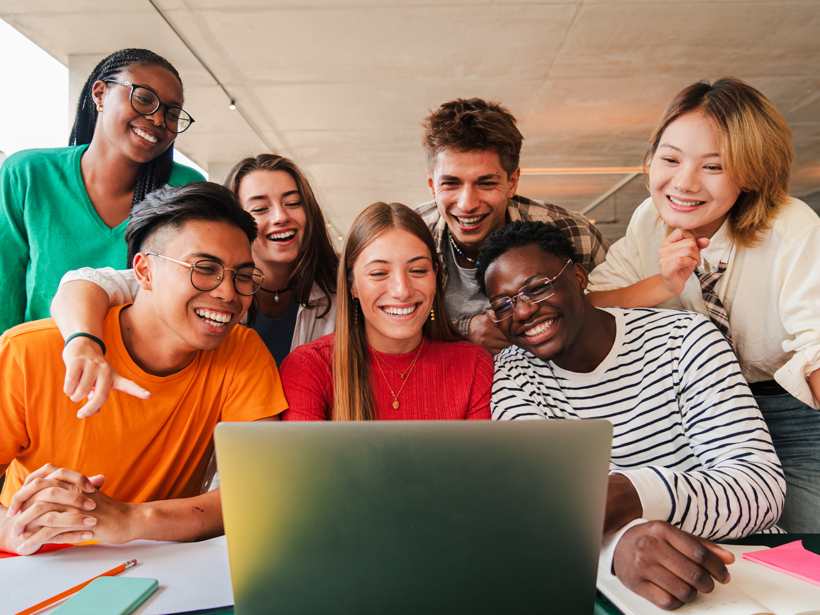 group of students in front of laptop