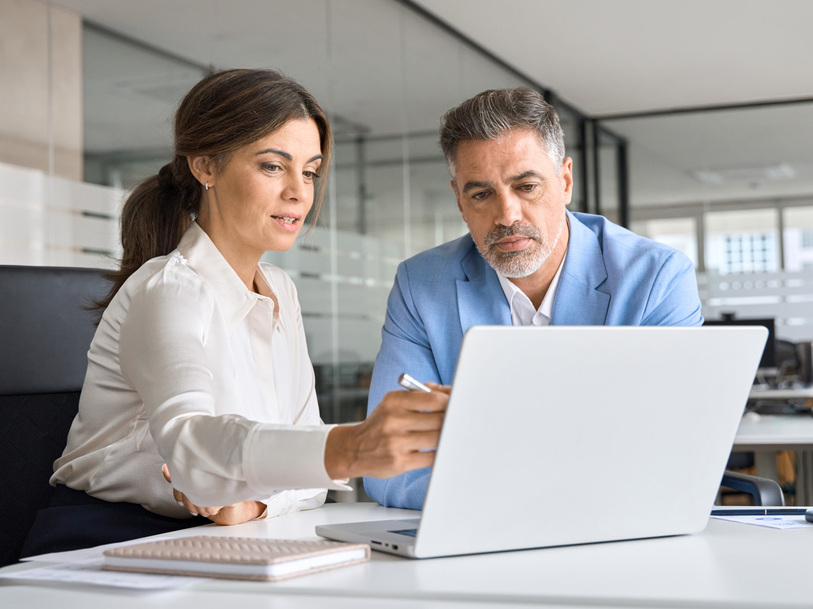 two people at a laptop